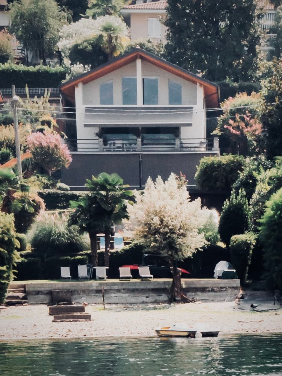 The house and shoreline seen from the lake